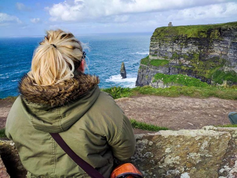 Woman looking at the Cliffs of Moher